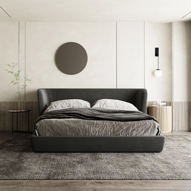 Winged headboard silhouette with bed frame and cot design in dark charcoal fabric