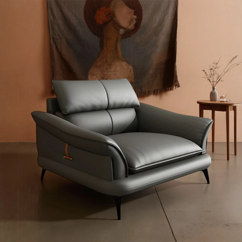 Wide leather armchair with flared arms + lounge room chair + leather armchair + black legs