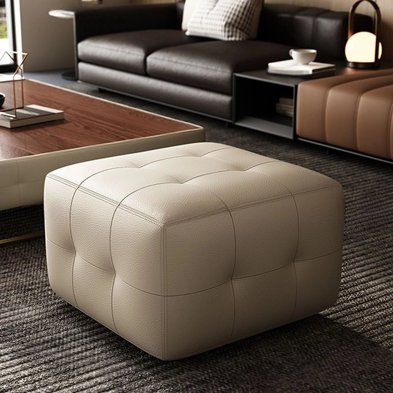 Square tufted ottoman photo with footrest charm and pouffe design in ivory faux leather
