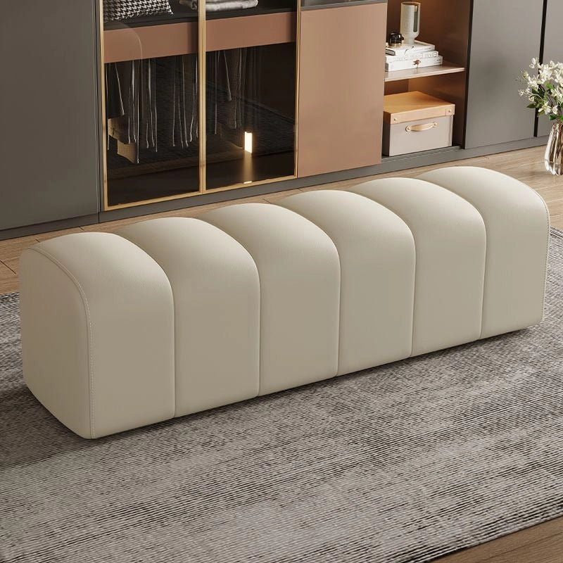 Cream faux leather designer bench ottoman with bold channels and bed bench silhouette