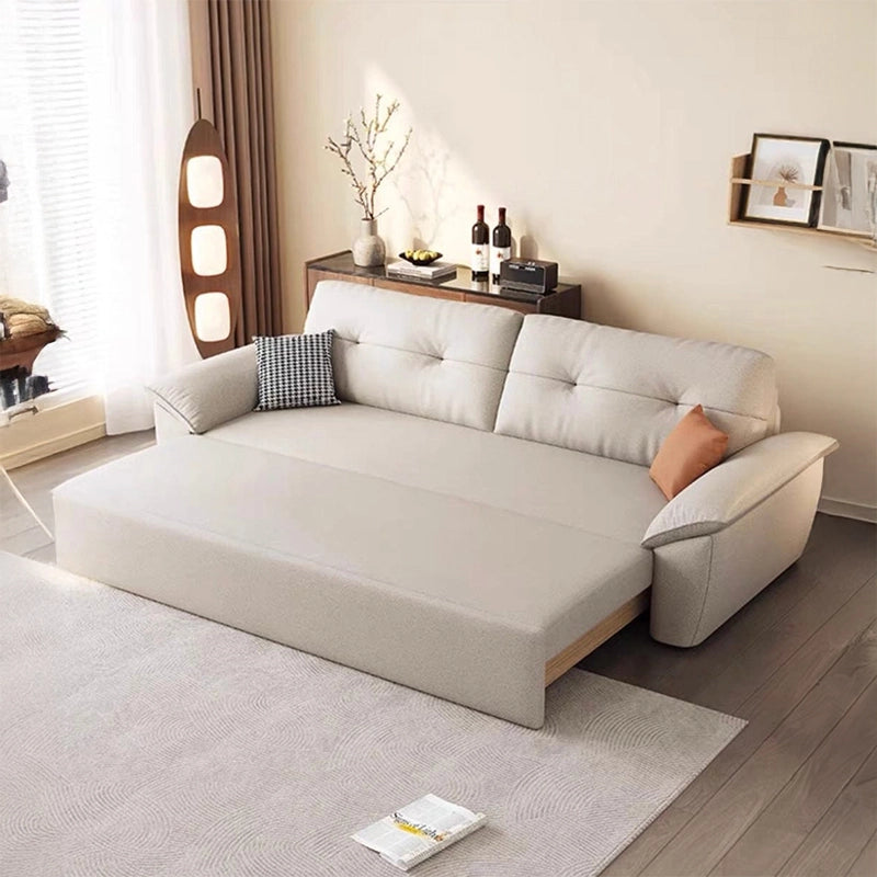 Tufted seat design with pillow arms sofa cum bed design in beige tone