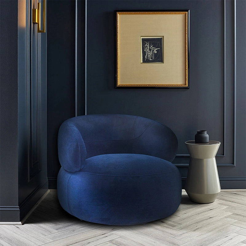 Navy velvet lounge room chair with reading armchair shape and concealed round seat base