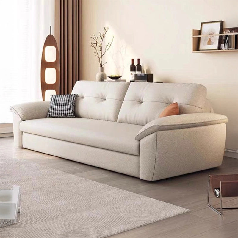 Pull-out convertible couch sleeper with textured fabric and accent cushions