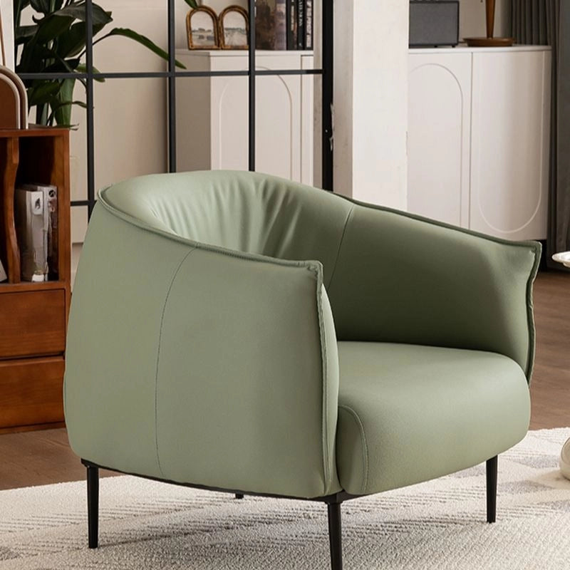 Slim black legs and piping detail — reading armchair + single couch