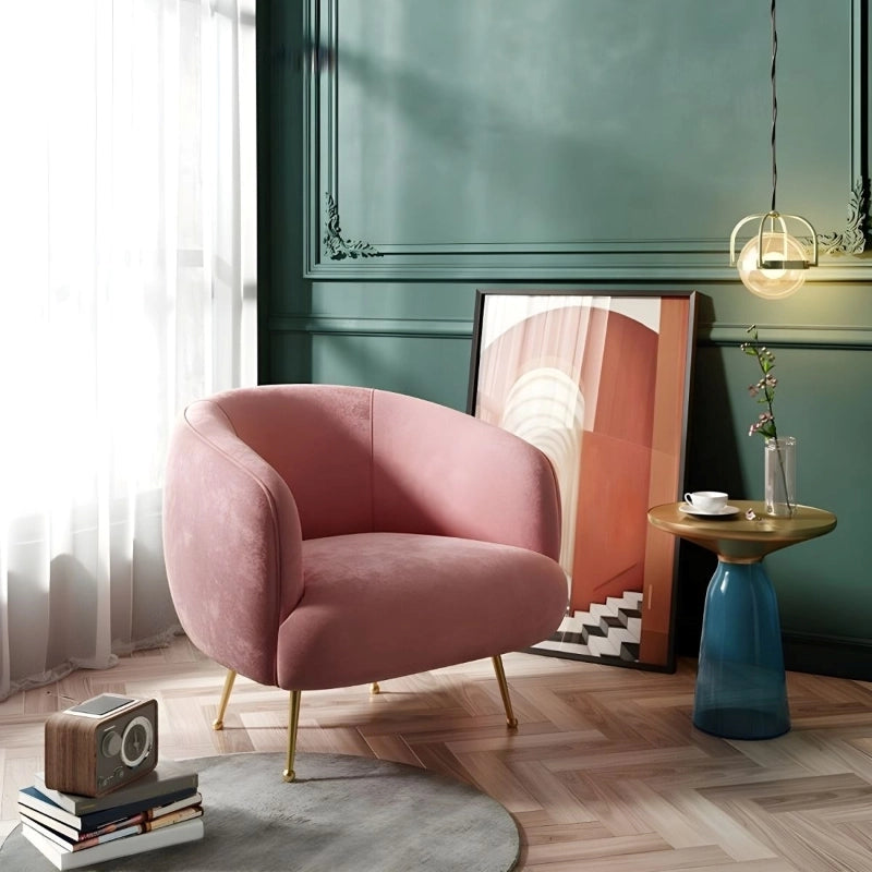 This rounded velvet armchair blends elegant lines with practical comfort, making it ideal as a single seater sofa or lounge room chair.