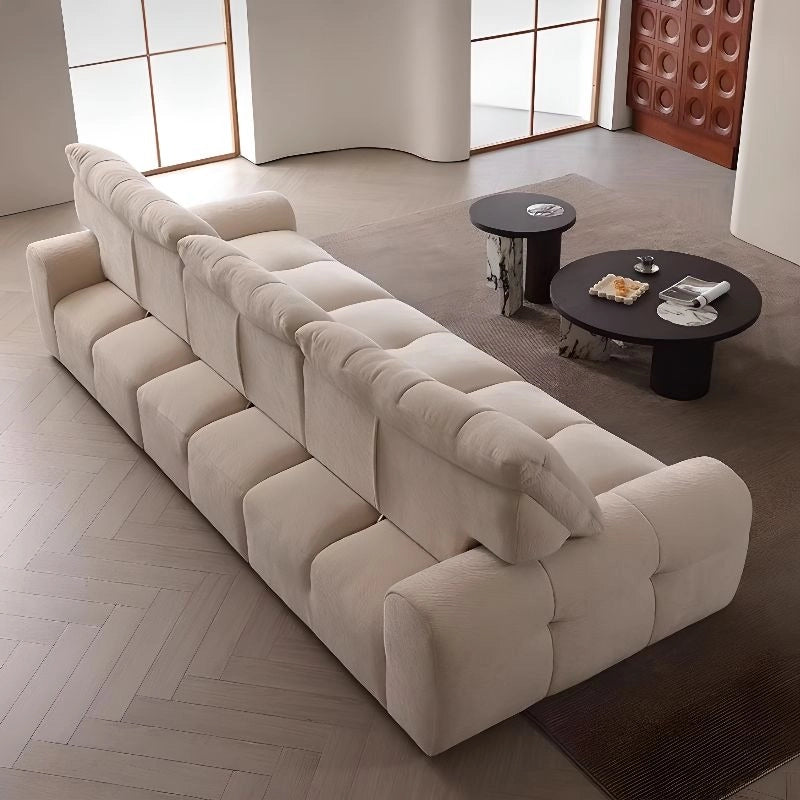 Tufted beige couch with cloud-like texture, convertible sofa design, rectangular 3-seater
