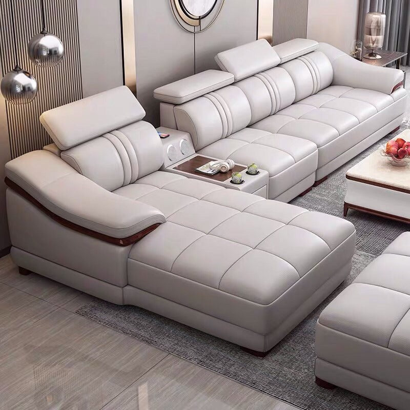Curved armrest detail of Phoenix L shape sofa set with wooden trim, ivory leatherette finish and luxury corner sofa design