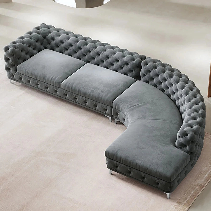 Front view of Polonium Chesterfield luxury sofa featuring velvet sofa upholstery, L shape sofa set layout, corner sofa design, 5 seater sofa comfort and premium lounge sofa styling