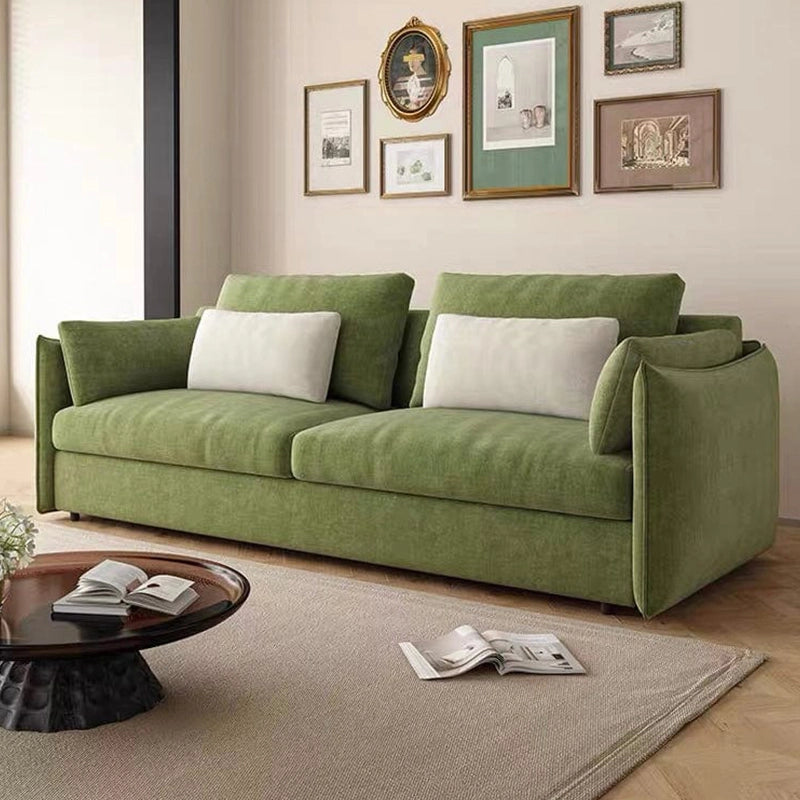 Front view of Toris olive green sofa cum bed featuring sofa cam bed functionality, sofacumbed versatility, fold out couch bed design, breathable woven fabric upholstery, bolster cushions and modern compact living room styling