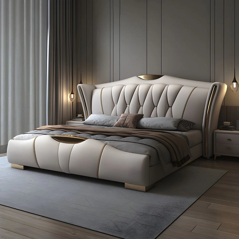 Spear upholstered bed with king size bed comfort, wingback headboard, gold piping detail, beige leatherette upholstery and modern bed frame styling for master bedrooms