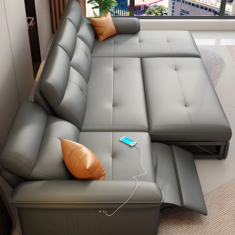 Juno Sofa Cumm Bed with grey leatherette L shape sofa bed design, tufted seat cushions, sleeper sofa style and convertible sofa bed functionality.
