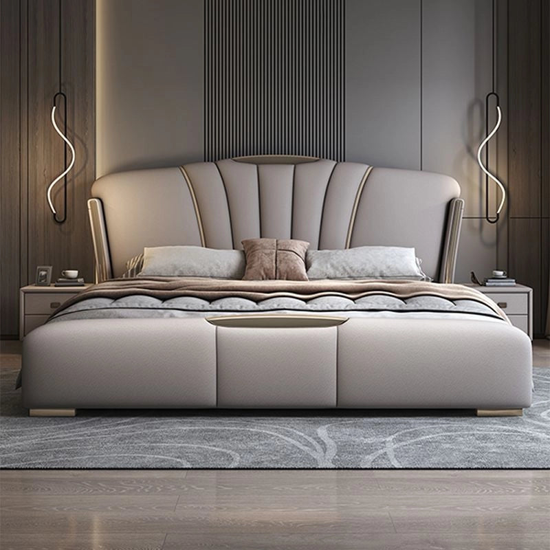 King size upholstered bed featuring faux leather finish, modern bed frame construction, platform bed support and elegant fan-style headboard detailing