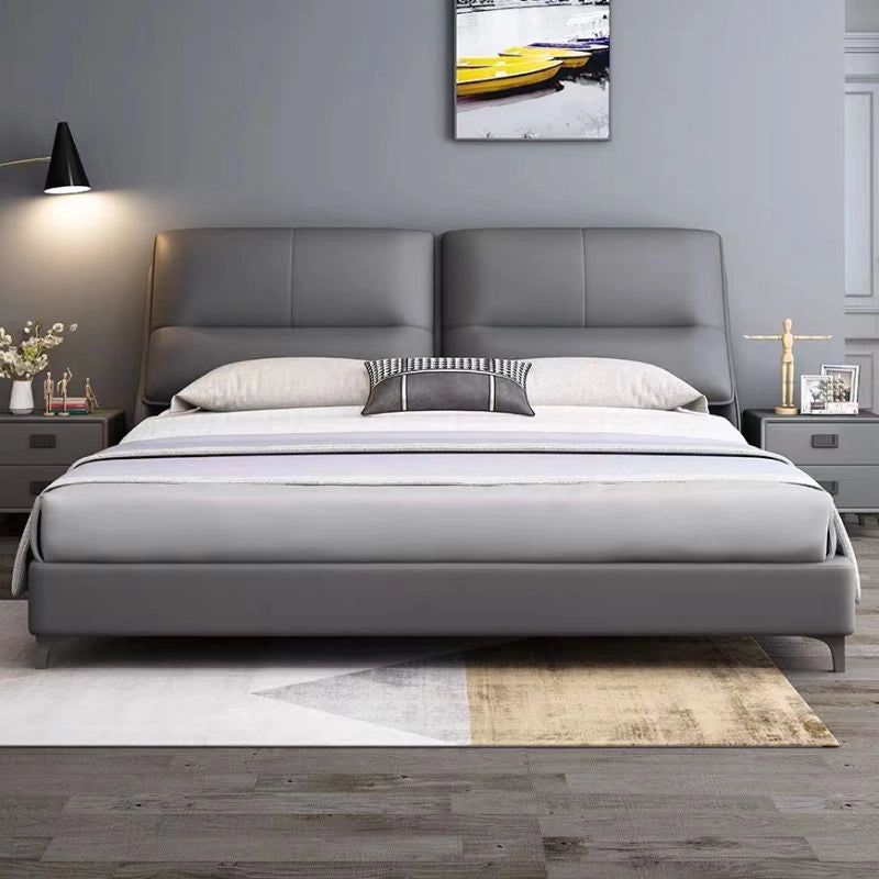 King size upholstered bed featuring a dual-panel headboard with horizontal stitch detailing, soft padded upholstery and contemporary modern bed frame design