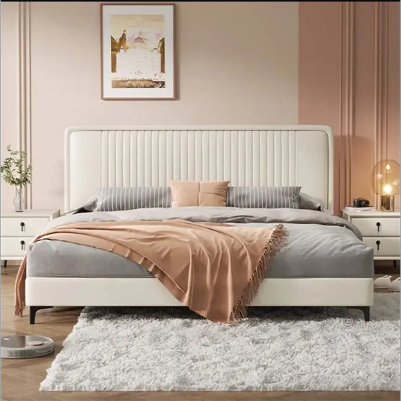 King size upholstered bed featuring leatherette upholstery, modern bed frame styling, low-profile platform base and ergonomic padded headboard