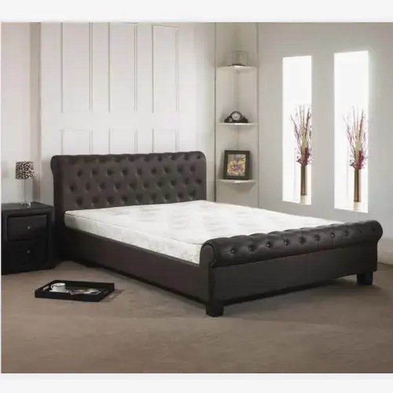 King size upholstered bed featuring a tufted sleigh headboard, matching footboard, faux leather finish and sophisticated modern bed frame design