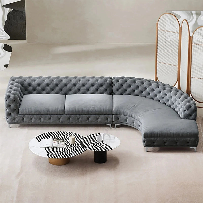 Front angle view of Polonium Chesterfield luxury sofa with deep button tufting, velvet sofa finish, modern sofa appeal and elegant living room sofa styling