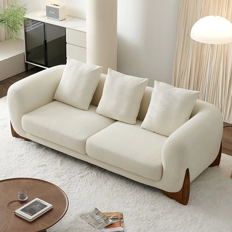 Beige sofa with cushions in a living room setting