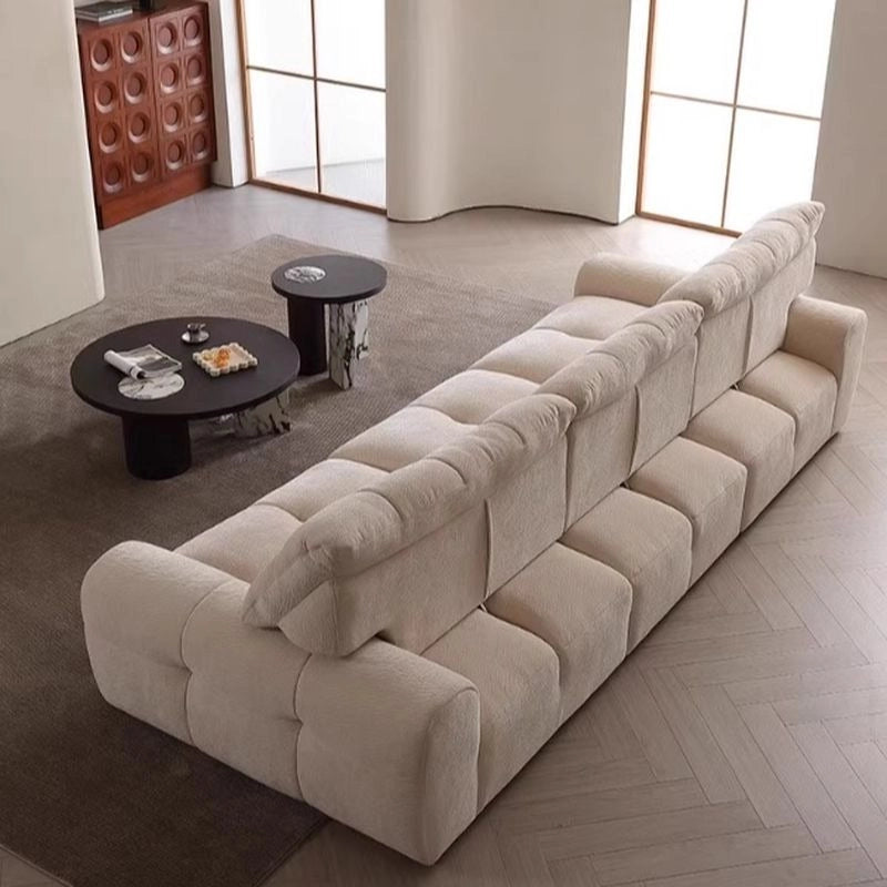Calvyn Luxury Sofa Set featuring plush overstuffed backrest cushions, soft fabric arm details, modular seating and premium lounge sofa comfort