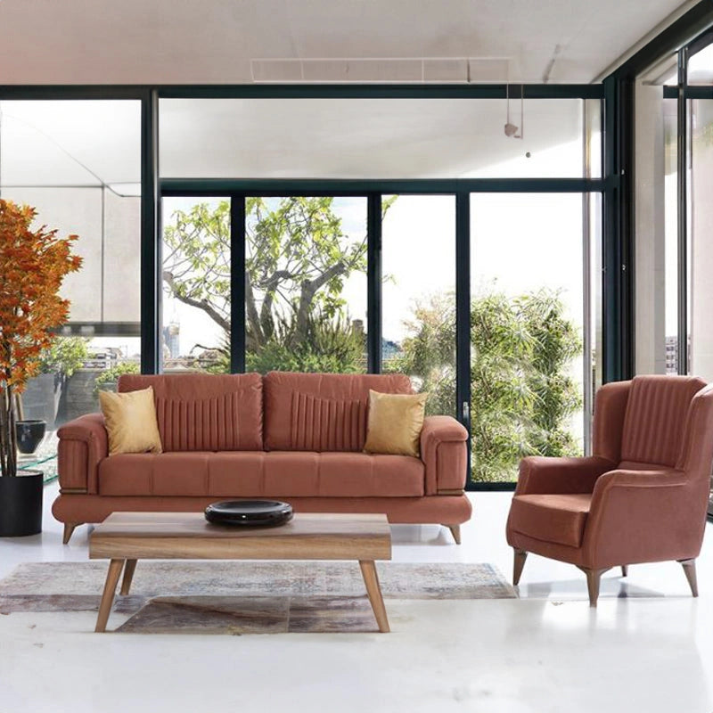 Modern living room with a brown sofa and armchair in front of large windows.
