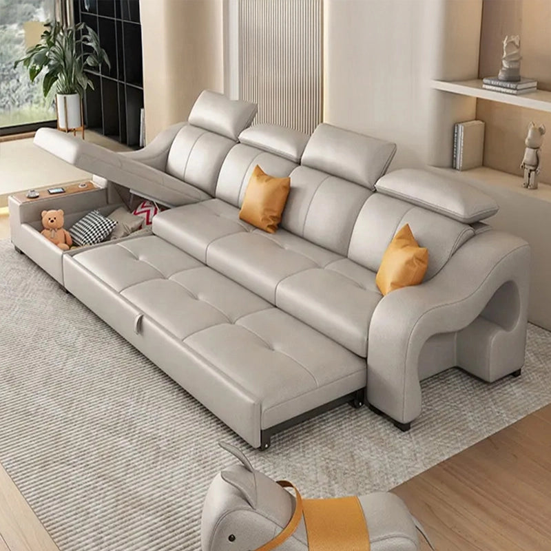 Nova Sofa Cumm Bed with open under-seat storage, L shape sofa cum bed design, beige upholstery, mustard contrast pillows and convertible couch bed functionality.