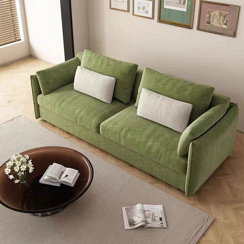 Side profile view of Toris olive green sofacumbed featuring couch bed versatility, fold out sofa bed mechanism, low profile base and supportive cushioning