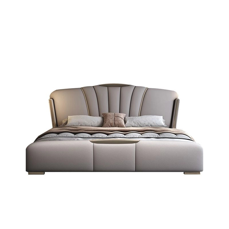 Hero view of Tomar luxury upholstered bed combining king size upholstered bed comfort, modern bed frame design, faux leather upholstery and sculptural headboard styling