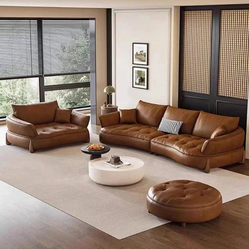 Top angle view of Satet leather sofa set with leather couch upholstery, luxury sofa appeal, sculpted wave profile, designer couch elegance and contemporary sofa design details