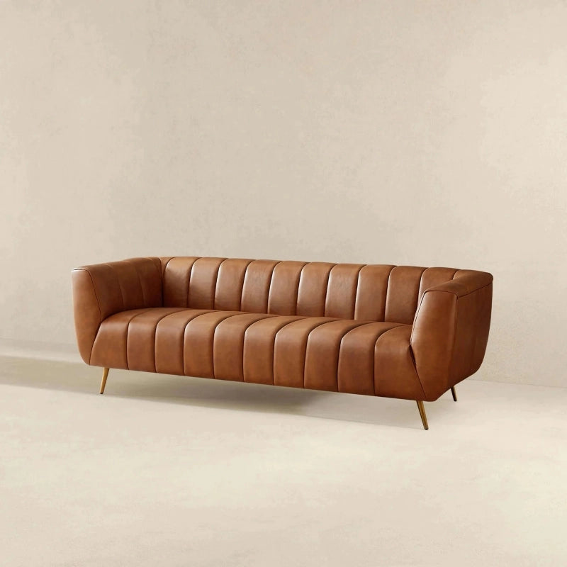 Close-up detail view of Sabryn leather sofa set highlighting vertical channel tufting, luxury sofa craftsmanship, premium leather couch upholstery, modern sofa design and living room elegance