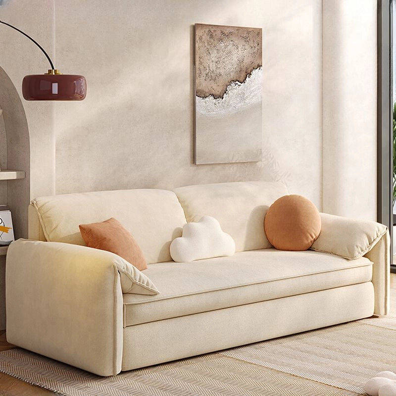 Close-up detail of sofacumbed featuring couch bed comfort, plush cloud-shaped cushions, soft woven upholstery and refined stitching details