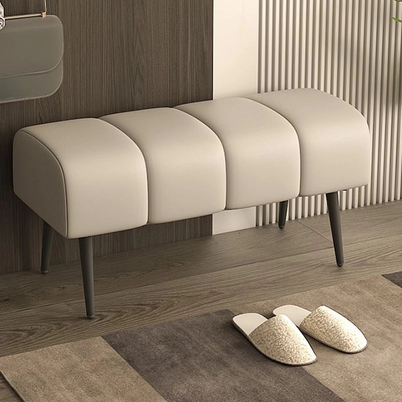 The minimalist, armless form and black tapered legs give it an airy, floating presence