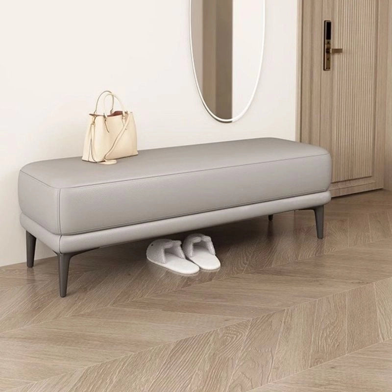 Wrapped in smooth faux leather upholstery, this bench ottoman boasts a modern Scandinavian-inspired design with clean lines, a dual-layer padded seat, and sturdy black tapered legs