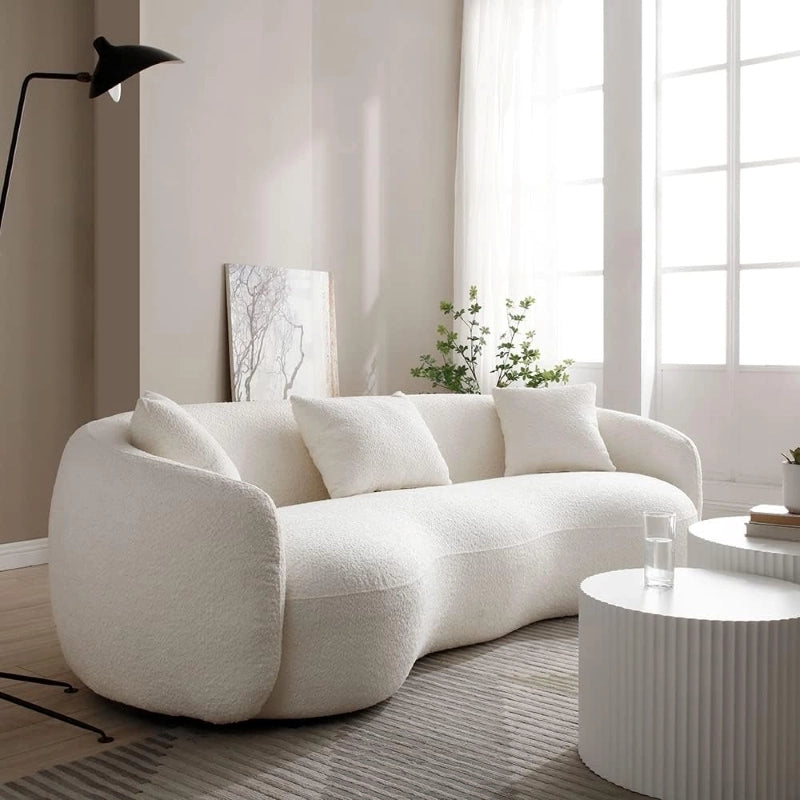The sculptural arm profile and cohesive cushion set add to the lounge sofa appeal