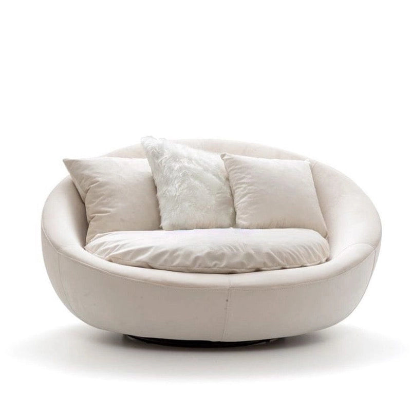 Whether styled as a reading armchair or an individual sofa chair, its seamless curves and sturdy Neem Wood construction offer lasting quality.