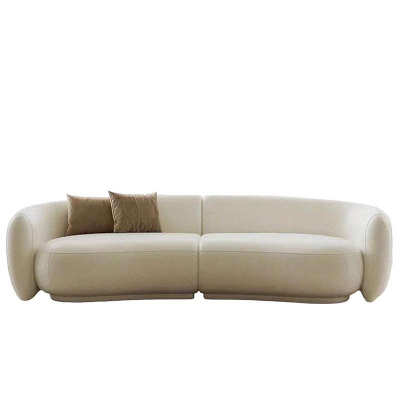 This stylish sofa design suits minimalist living rooms and doubles as a durable leather couch for pet owners