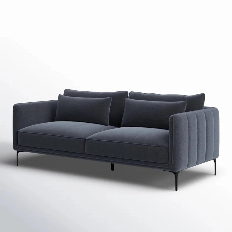 Each piece features deep seats, loose cushioned backs, and a sleek, space-conscious silhouette. 