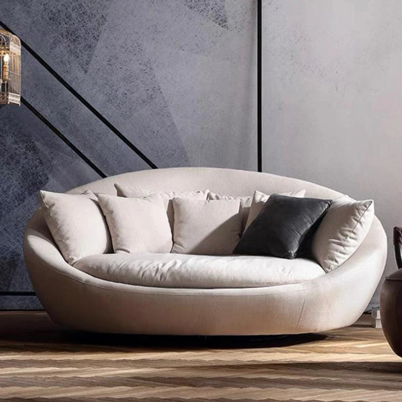 The armless, bowl-shaped silhouette sits atop a smooth swivel base, making it a stunning addition to any modern décor