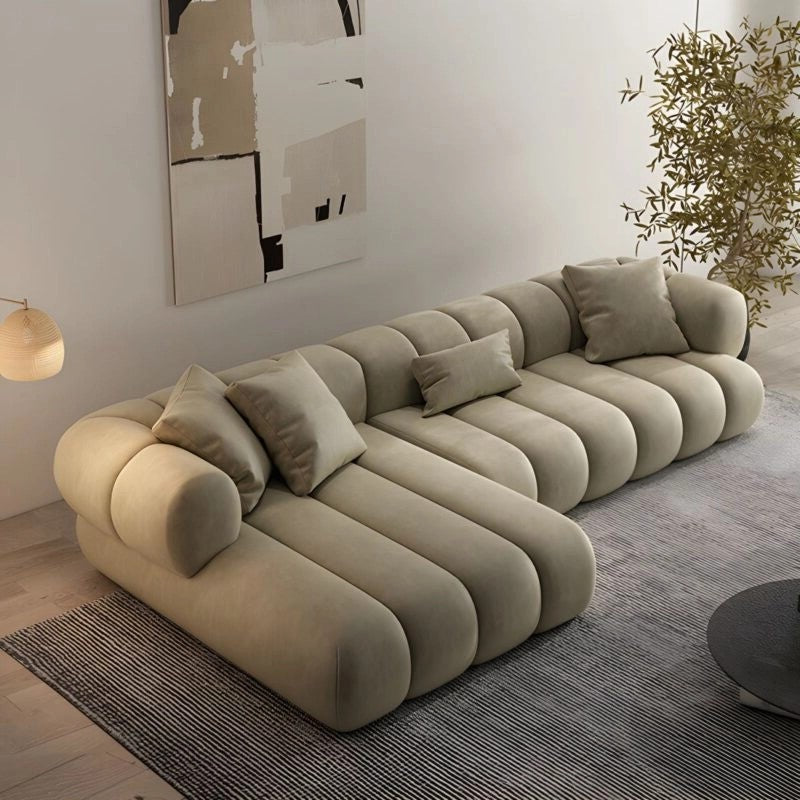 Beige L Shape Sofa Set with modular corner sofa layout, deep lounge sofa comfort, luxury couch set styling and modern living room décor with abstract art and indoor plant