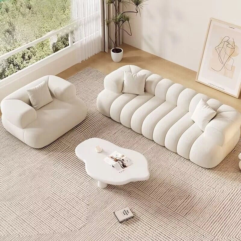 Available in neutral shades like beige, charcoal, and white, this stylish sofa design adapts easily into a l shape sofa set or corner sofa layout