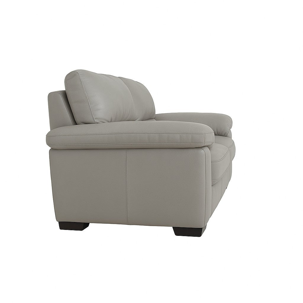 Light grey leather sofa set with cushioned armrest and visible stitching detail