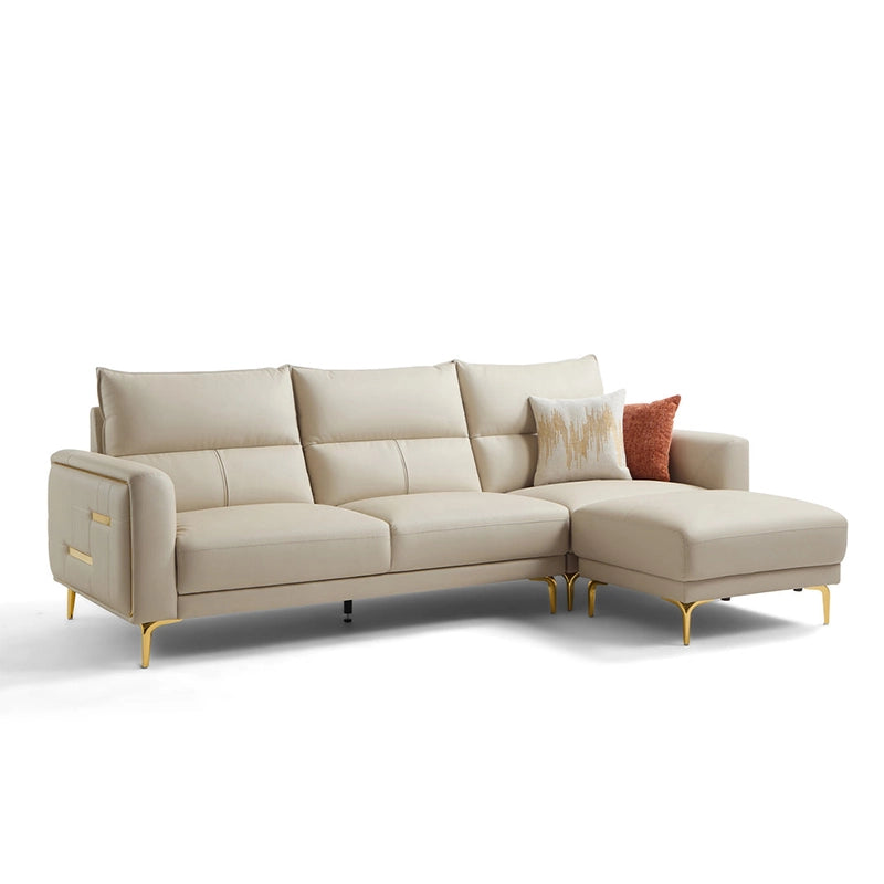 Upholstered in beige leatherette with a matte finish, it includes golden legs and inset arm accents, creating a sleek yet luxurious presence