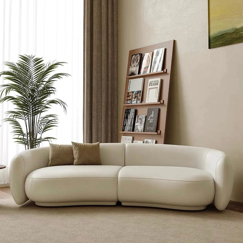 Creamy white kidney sofa crafted as a premium 3 seater sofa with leather sofa appeal, luxury couch styling, sofa set versatility, and timeless living room sofa comfort.