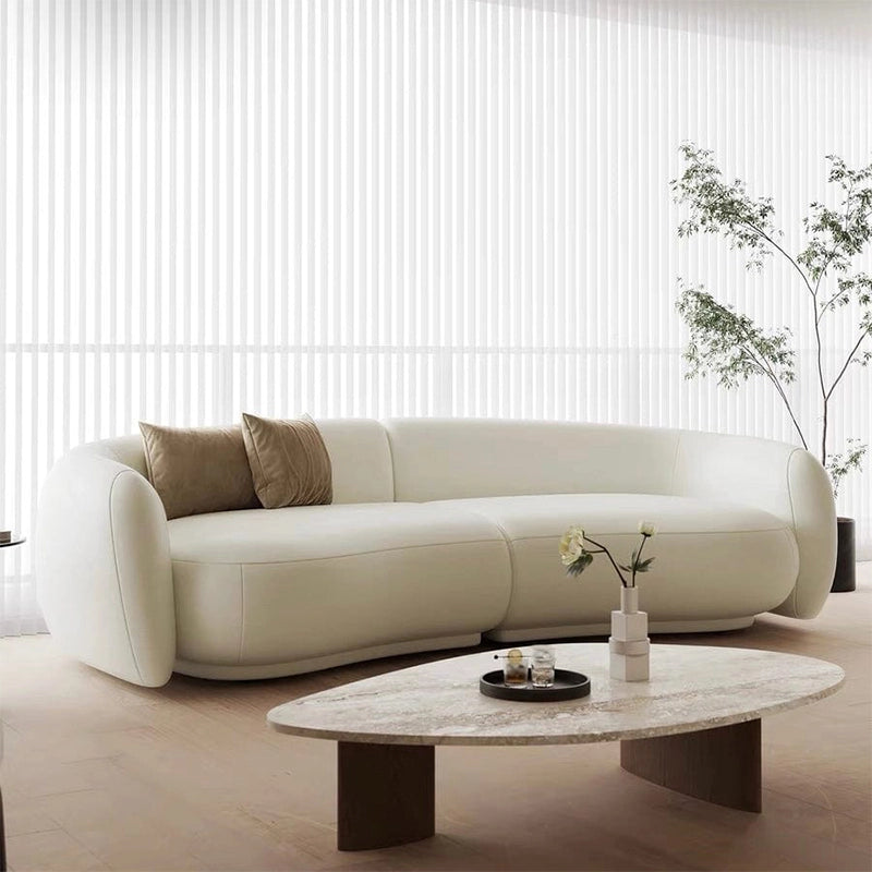 Creamy white kidney sofa functioning as a sophisticated 3 seater sofa, leather sofa, sofa set, and versatile set of sofa solution for premium home interiors.