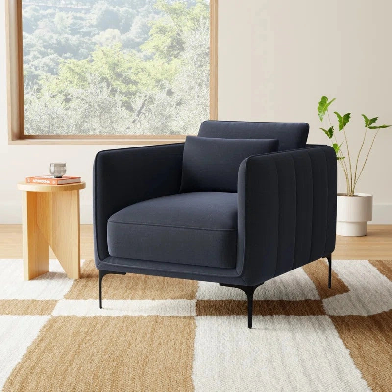 Soft velvet and faux leather options are enhanced by slender black legs and vertical channel tufting - 1 seater