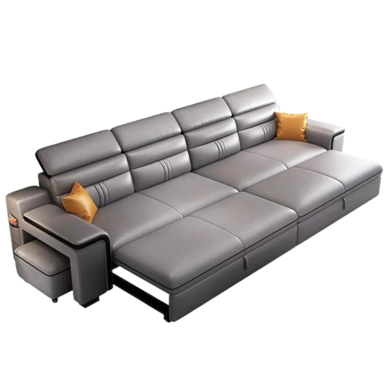 Features include a storage chaise, pull-out footrest, and integrated side table with USB and wireless charging