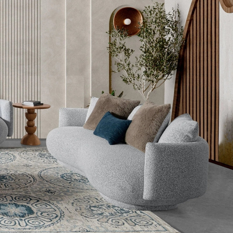 Front view of sculptural light grey settee, stylish sofa design and fabric sofa style