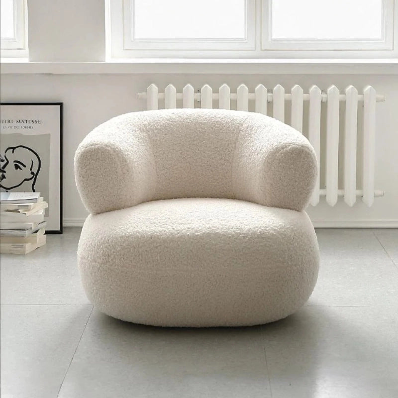 Barrel-back accent chair photo styled as single couch with individual sofa chair function