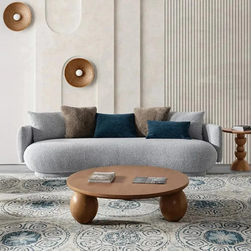 Close-up of furry + velvet pillows on sofa, fabric couch and settee design elements