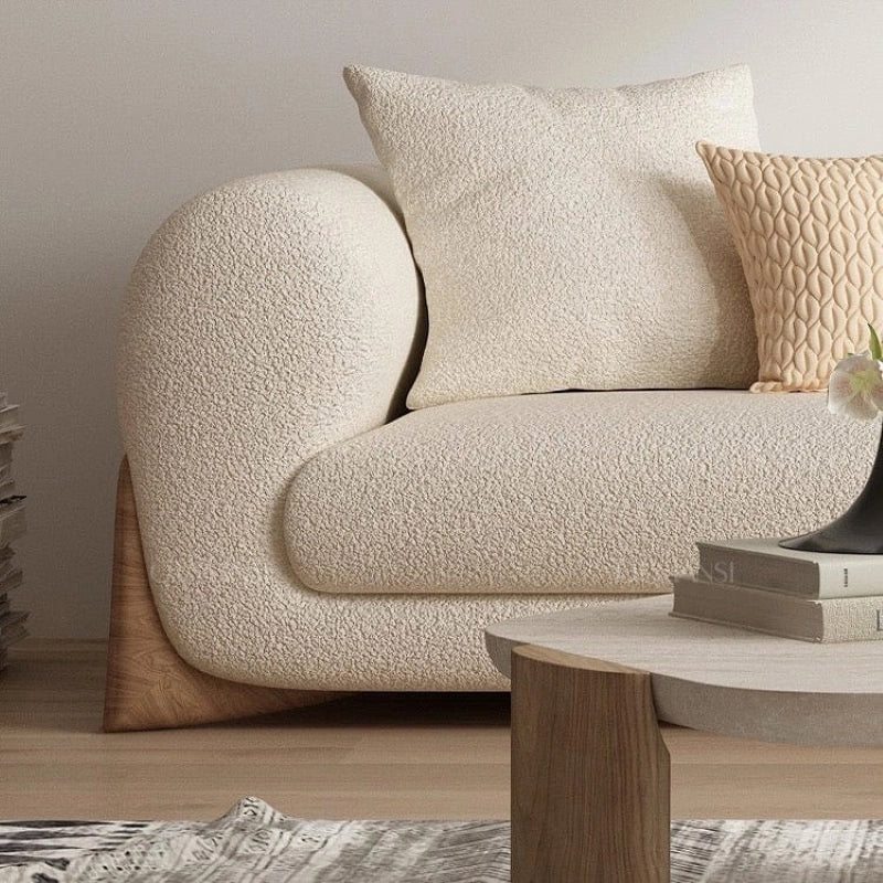 Soft, scatter-style backrest cushions with living room couch and sofa set design – bouclé
