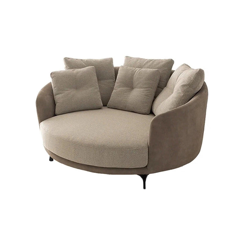 Its oversized circular seat and wraparound shelter arms make it a sculptural comfort chair for urban Indian interiors.