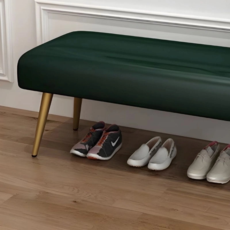 Ideal as an entryway bench or bedroom bench, this sleek two-seater unit features a smooth faux leather finish and softly curved edges. 